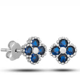 Boucles d'oreilles enfant en argent et pierre bleue sertie de trèfles